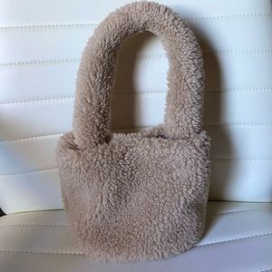 beige teddy bucket purse